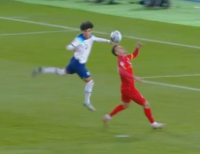 Rico Lewis (left) pictured moments after he apparently fouled Bojan Miovski during England's Euro 2024 qualifiers against North Macedonia in November 2023